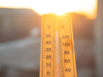 Thermometer on sky background. Sunset. Weather Versicherungsmakler Essen